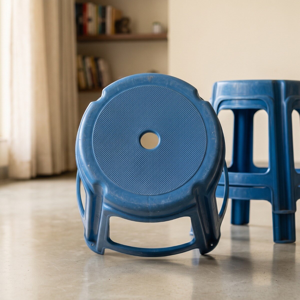 Why is there a hole in the middle of plastic stools?