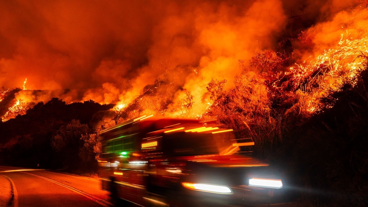 A firetruck passes as a wildfire burns in Europe. (Photo: AP) What made August 2026 hottest month ever on Earth while it was raining in India?