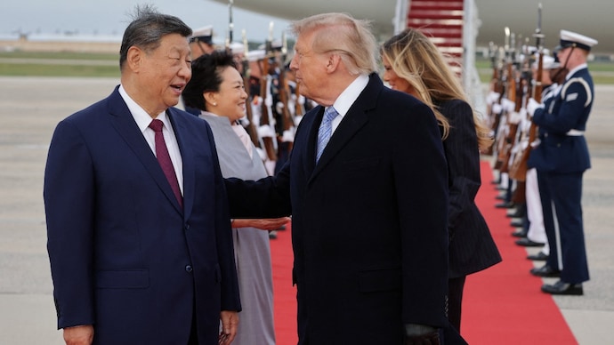US President Donald Trump and Chinese President Xi Jinping react as Xi arrives ahead of a state visit at Joint Base Andrews, Maryland, US, September 23, 2026. REUTERS/Jonathan Ernst