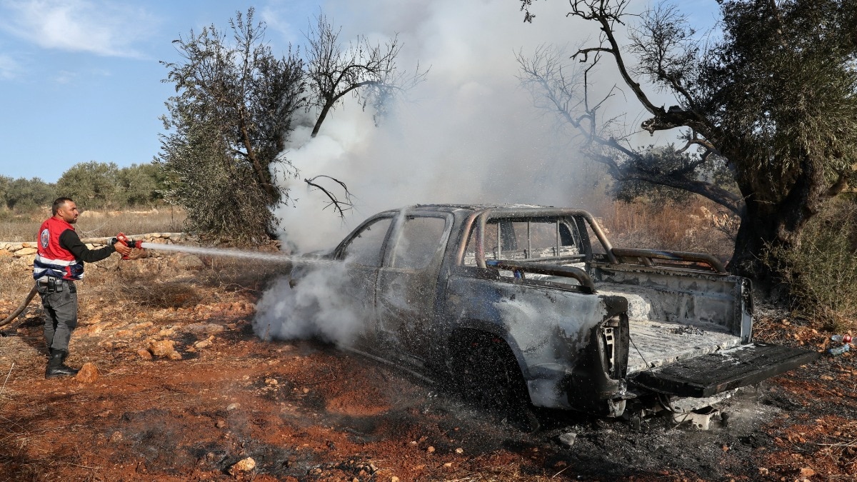 Israeli settlers torch cars, trees in 8 West Bank villages, beat journalist