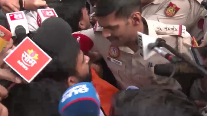 Abhijeet Dipke confronts cops before being taken into custody Abhijeet Dipke confronts cops before being taken into custody