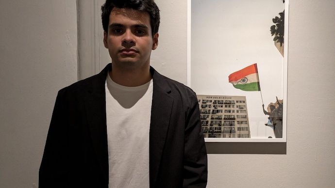 Artist and Photographer Raihan Vadra, son of Congress leader Priyanka Gandhi Vadra, with one of his photographs at Bikaner House, in New Delhi, Wednesday, Oct. 21, 2026. (PTI Photo) Artist and Photographer Raihan Vadra, son of Congress leader Priyanka Gandhi Vadra, with one of his photographs at Bikaner House, in New Delhi, Wednesday, Oct. 21, 2026. (PTI Photo)
