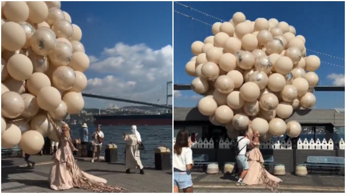 Bride's giant balloon bouquet nearly sends her flying during windy-day photoshoot