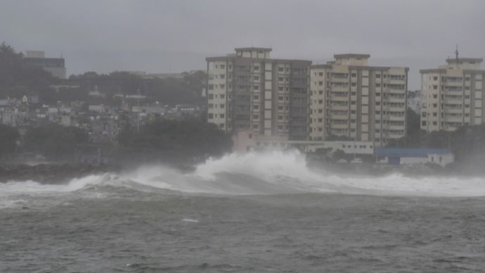 High tidal waves hit the coast under overcast skies amid rain in Visakhapatnam on Tuesday. (Photo: PTI)