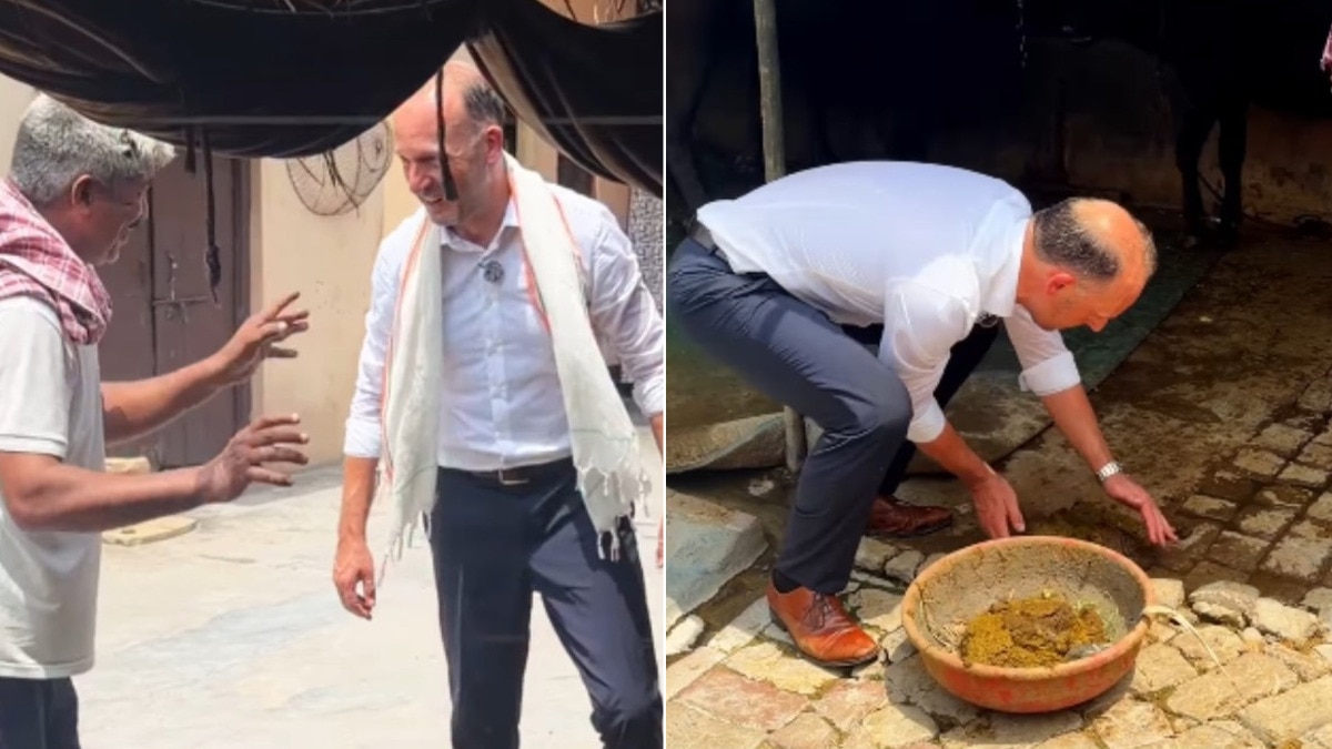German diplomat meets farmer in Indian village, wears gamcha, handles cow dung