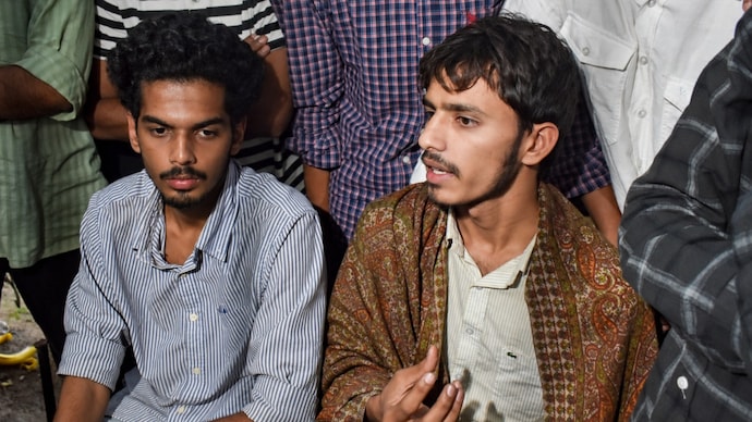 Jamia Millia Islamia students Rehan Khan and Ebin Basil, are on an indefinite hunger strike demanding student union elections as protests continue. (Photo: PTI) Jamia Millia Islamia students Rehan Khan and Ebin Basil, are on an indefinite hunger strike demanding student union elections as protests continue. (Photo: PTI)