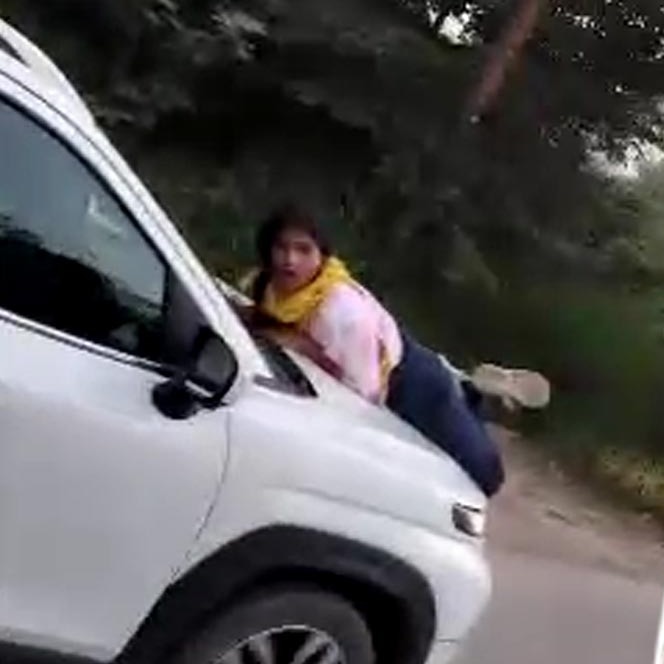 Video: Meerut woman clings to car bonnet after catching husband with lover