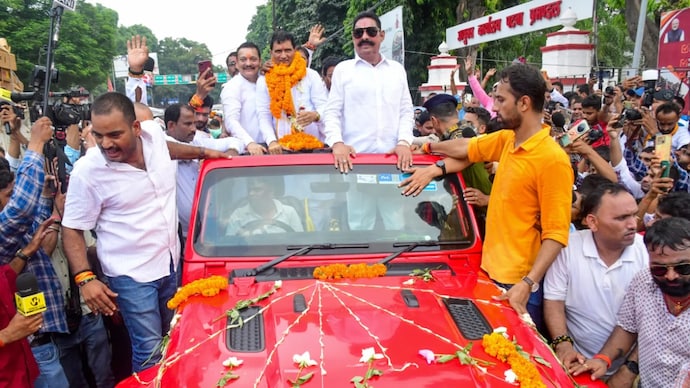 Police alleged that the procession involved more vehicles than permitted, with sirens sounded on several vehicles, while the deployment of JCB machines to shower flowers disrupted normal law and order. Police alleged that the procession involved more vehicles than permitted, with sirens sounded on several vehicles, while the deployment of JCB machines to shower flowers disrupted normal law and order.