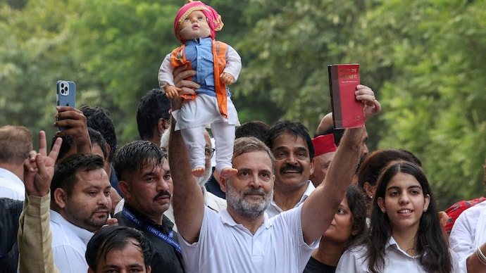 Rahul Gandhi holds a doll depicting Indian Prime Minister Narendra Modi as opposition parties march to the Supreme Court Rahul Gandhi