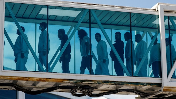 Venezuelan migrants walk a jet bridge upon arrival on an Eastern Airlines plane from the United States, at Simon Bolivar International Airport, in Maiquetia, Venezuela. ( File Photo- Reuters)