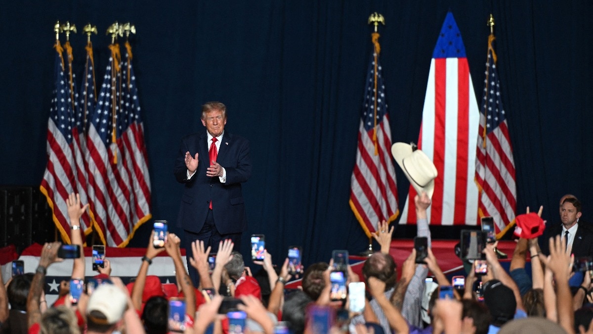 Going back to his mom: Trump mocks heckler, says protesters are paid by enemies