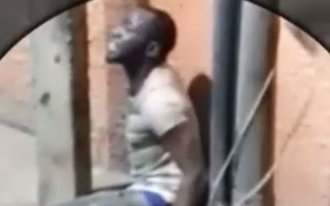 Black dude tied to pole