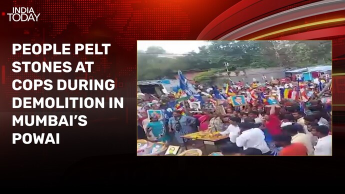 Mumbai police attacked with stones during demolition drive stone pelting in mumbai