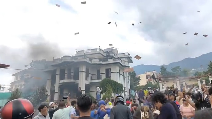 Protestors in Nepal toss currency notes in air