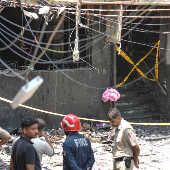 Video: Terrified guests jump from upper floors as fire tears through Delhi hotel