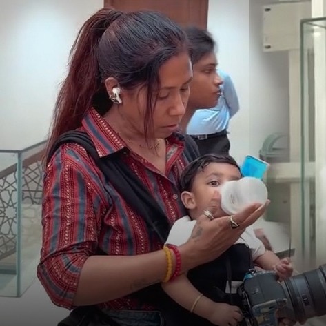 Why this photographer worked with a baby in her arms