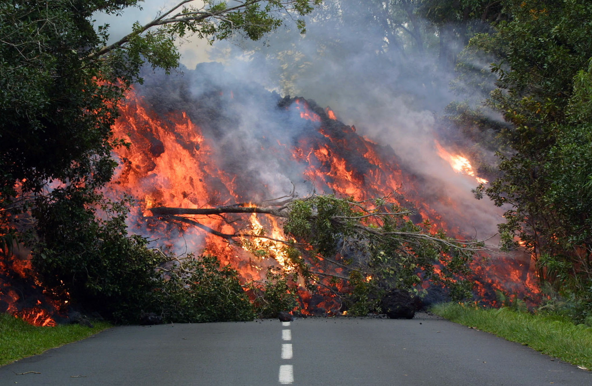 Molten lava from the volcano blocks the main national RN 2 road. (Photo: Reuters)