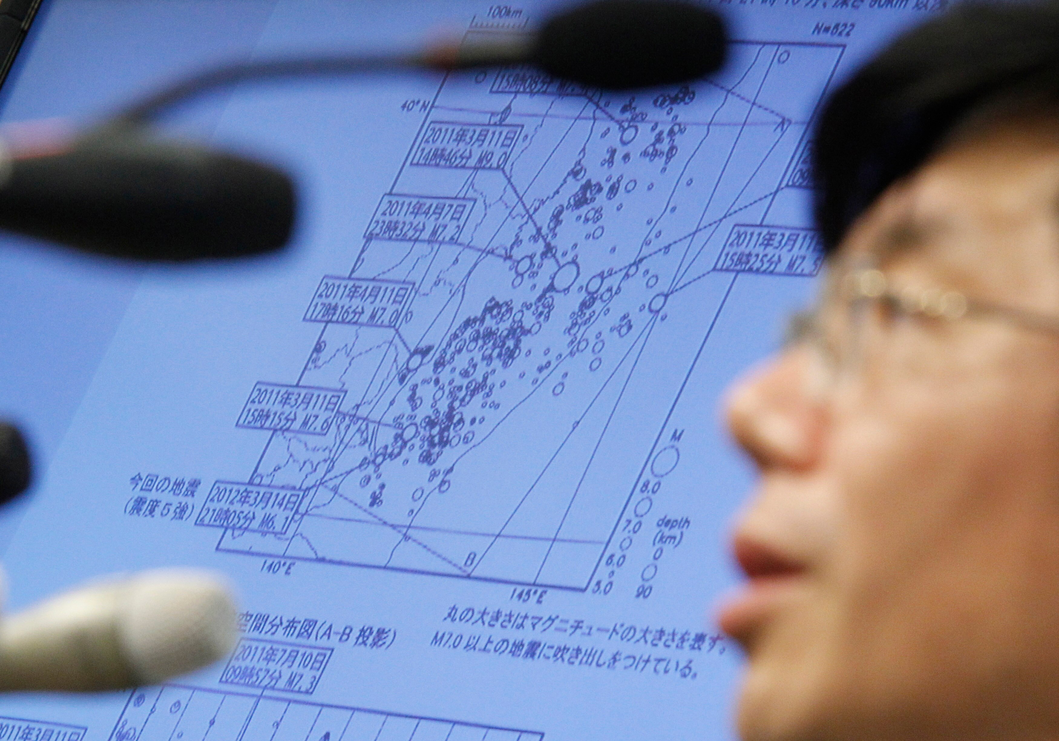 An official of the Japan Meteorological Agency speaks next to a screen showing an earthquake's epicentre. (Photo: Reuters)