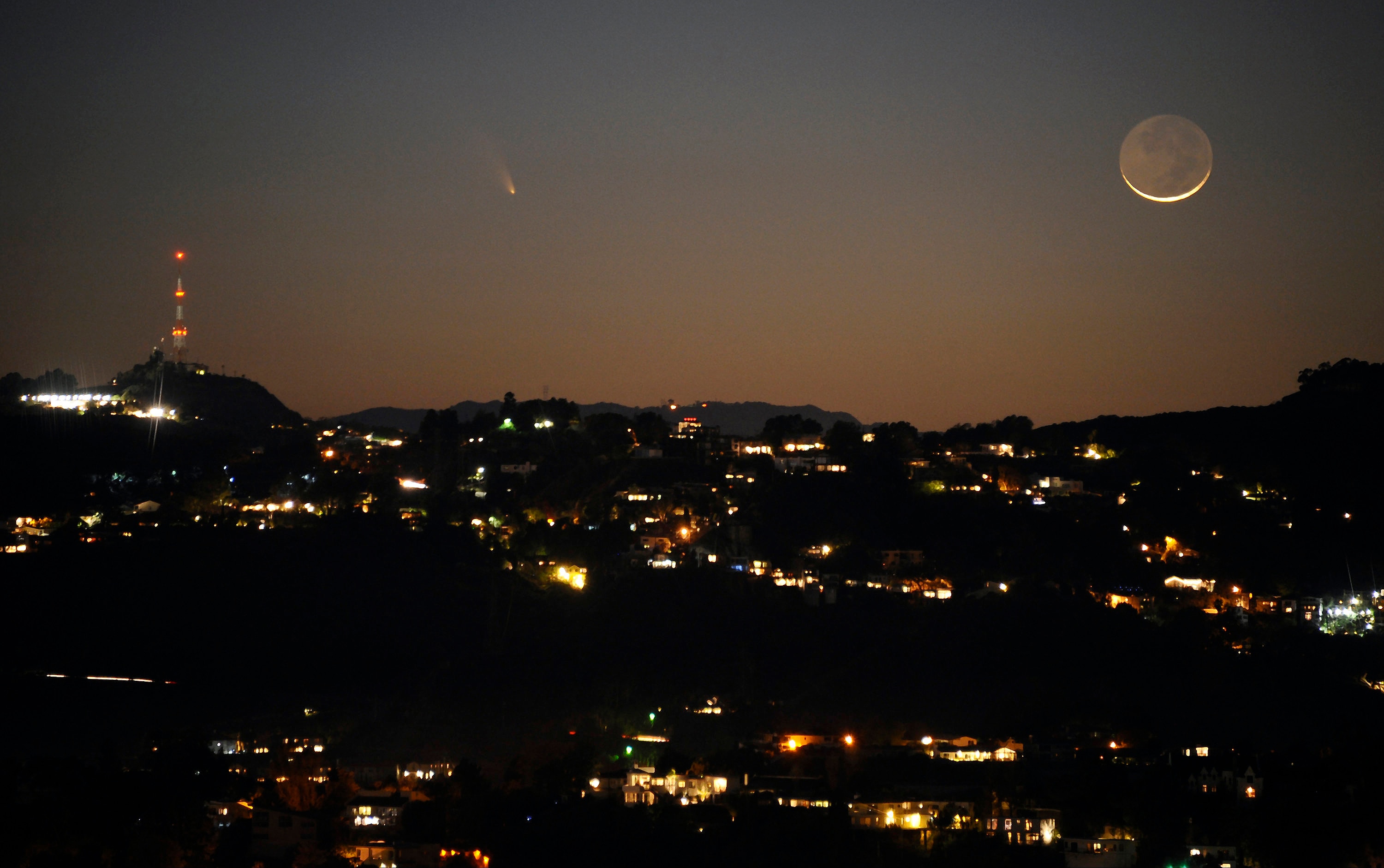 The comet PANSTARRS is seen next to the waxing crescent moon. (Photo: Reuters)