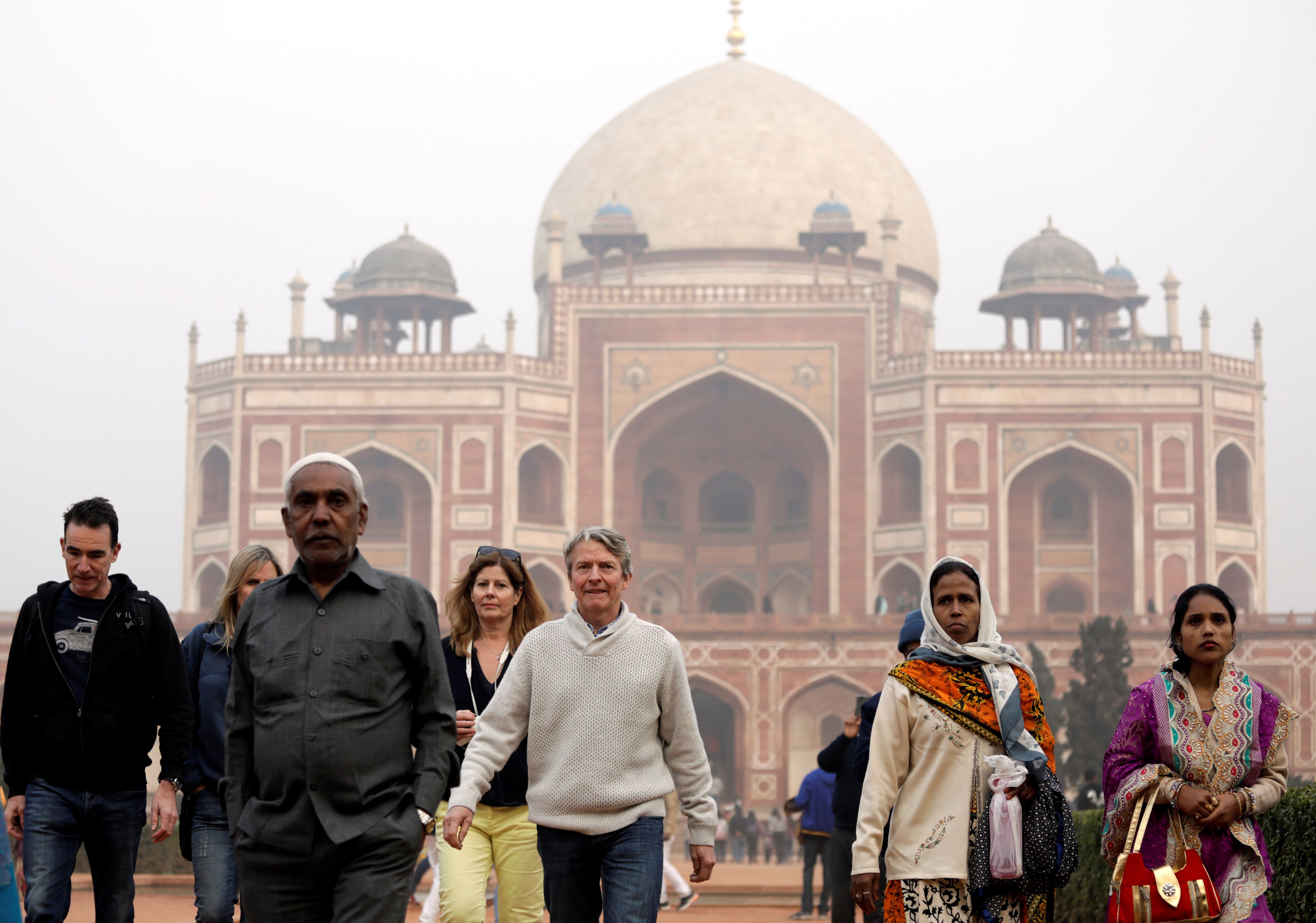 Tourists walk in front of Humayun's Tomb in Delhi. (Photo: Reuters)