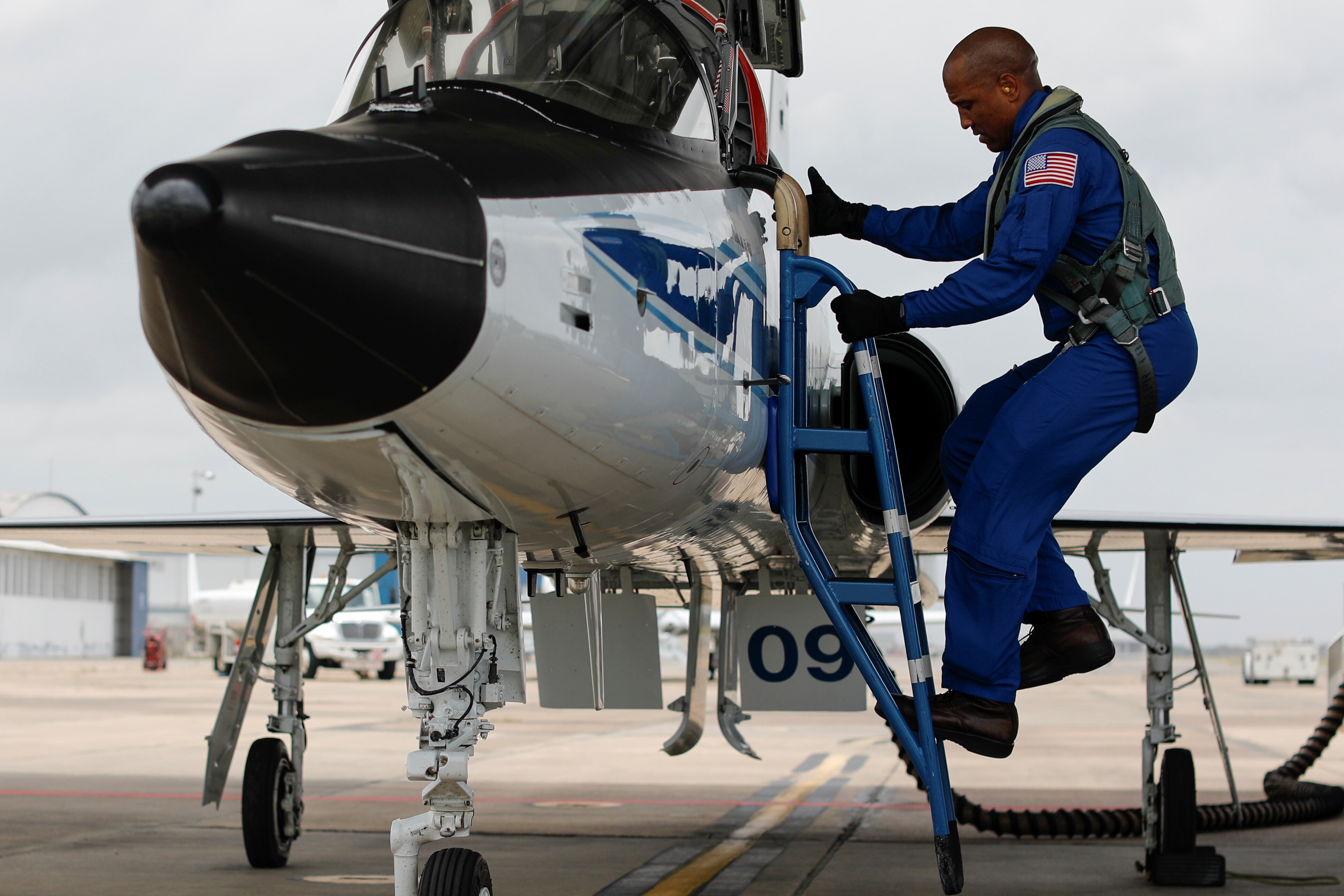 Victor Glover climbs into a T38 aircraft for a training flight. (Photo: Reuters)