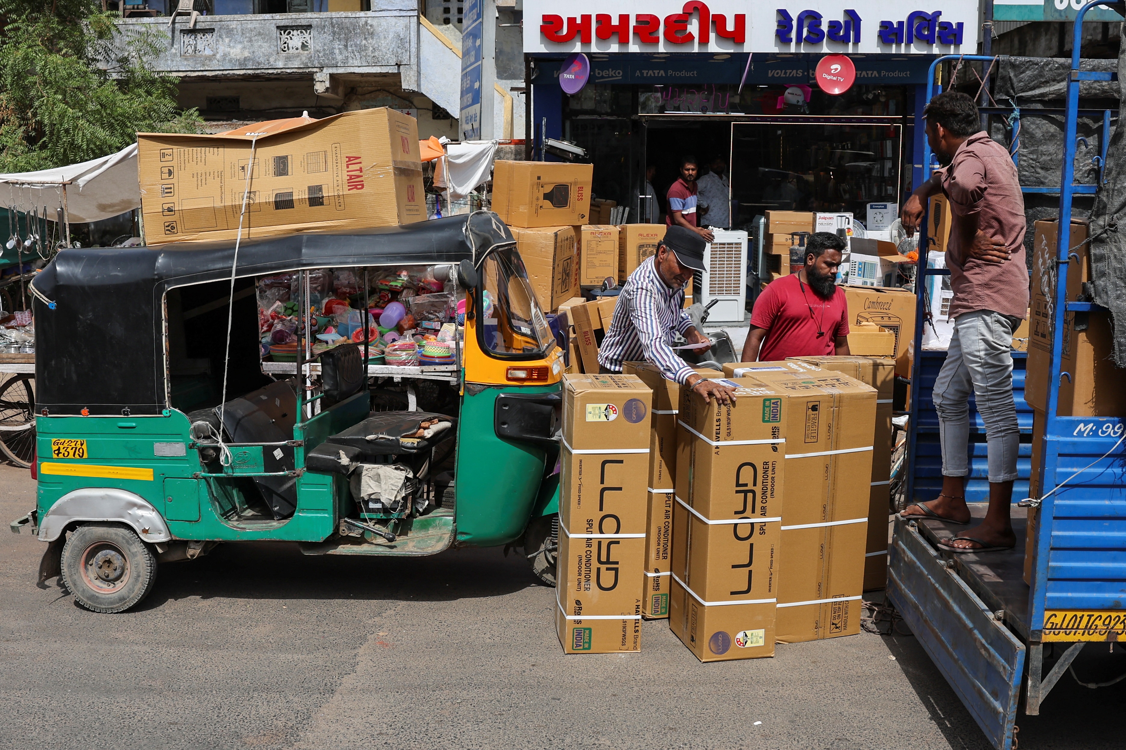 Workers count boxes of air conditioners during a heatwave in Ahmedabad. (Photo: Reuters)