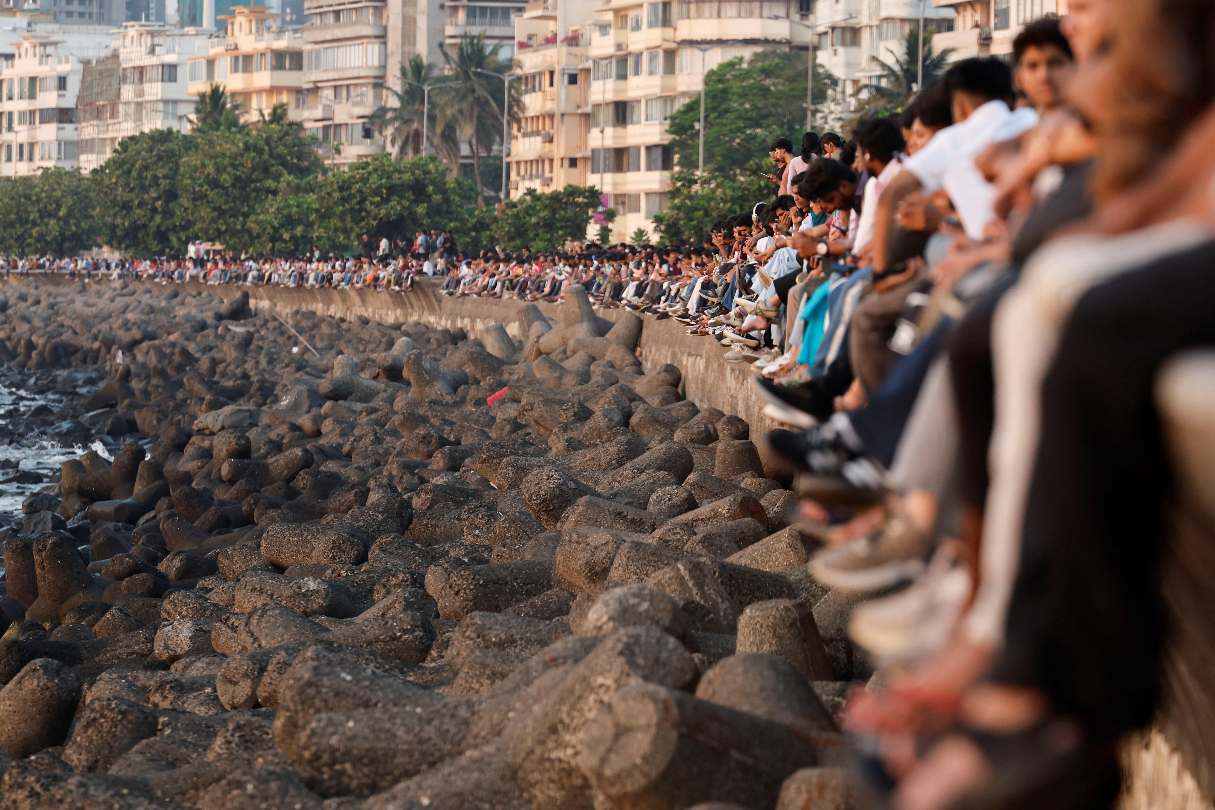 People watch the sunset at Marine Drive in Mumbai, India. (Photo: Reuters) 