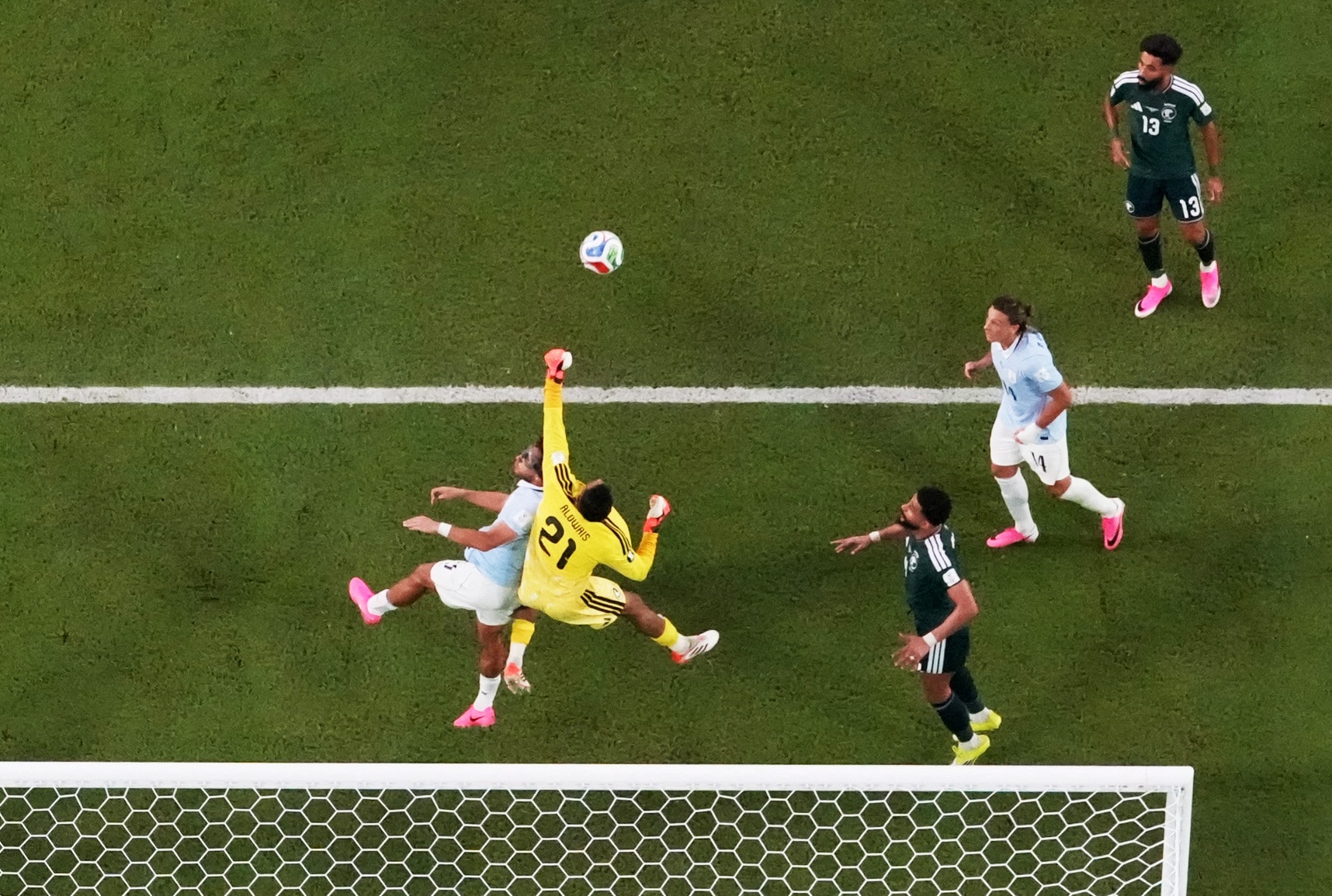 Saudi Arabia's Mohammed Al-Owais makes a save from Uruguay's Sebastian Caceres. (Image: Reuters)