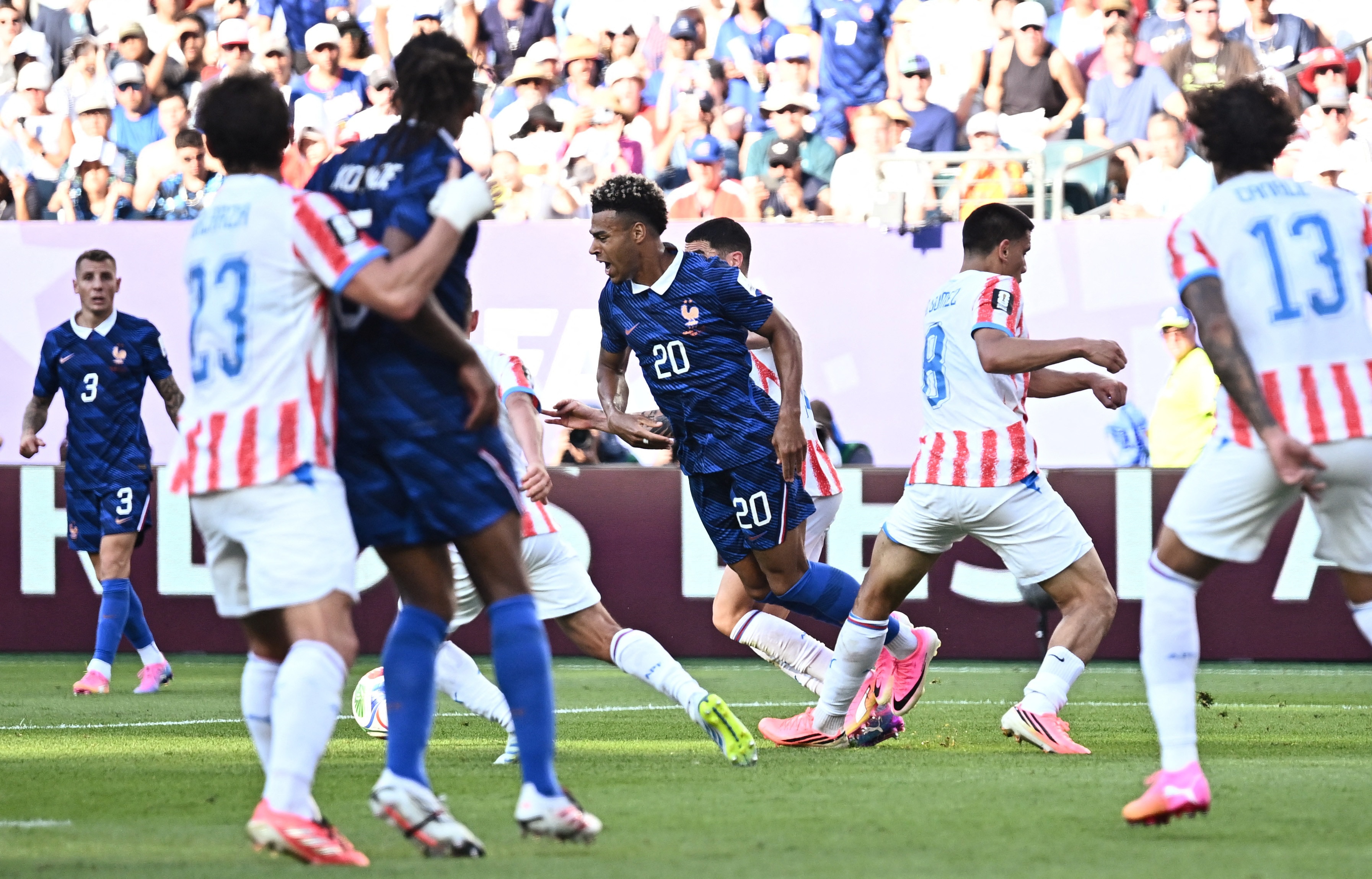 Paraguay's Diego Gomez concedes a penalty against France's Desire Doue. (Image: Reuters)