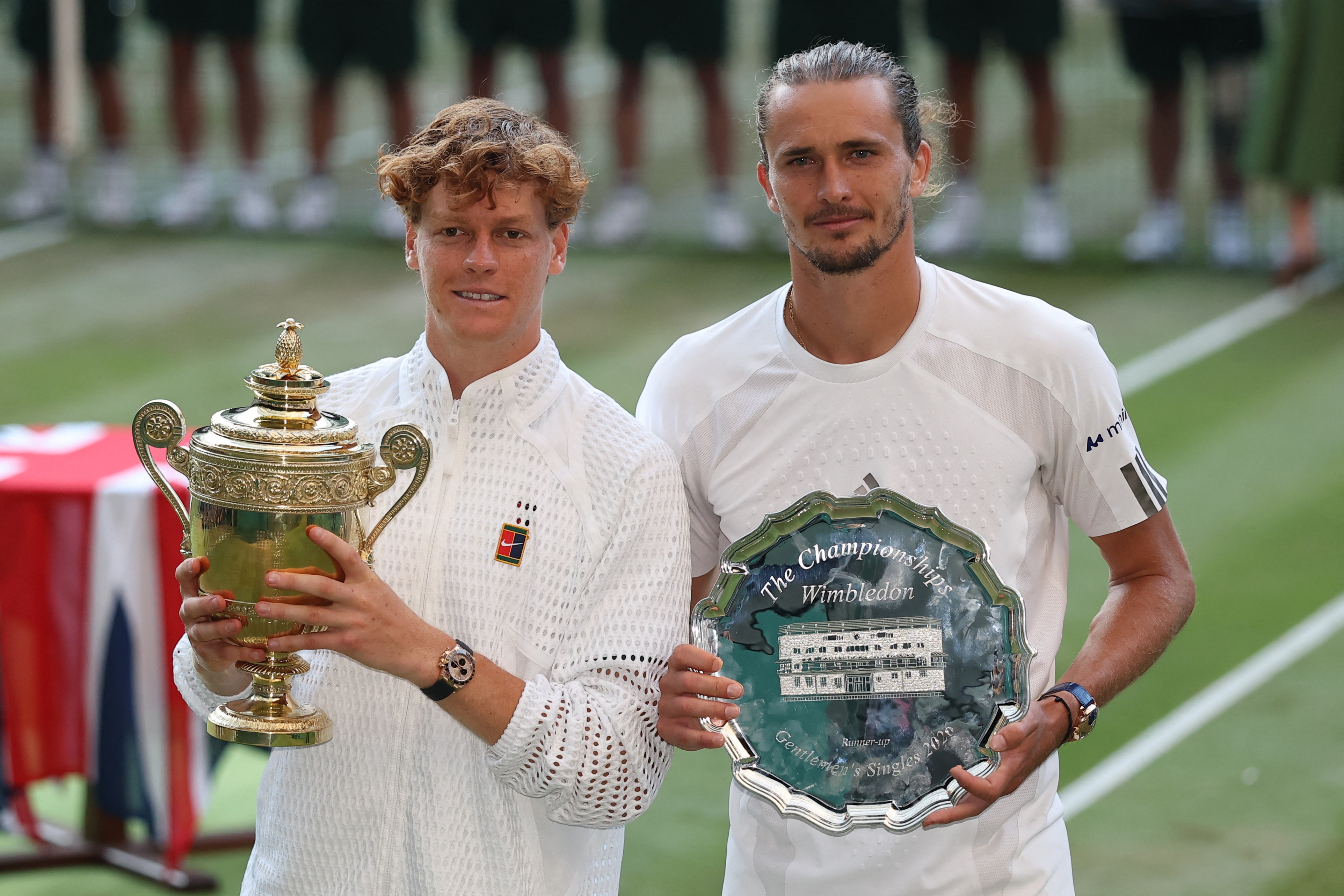 Jannik Sinner and Alexander Zverev pose with the trophies after the Wimbledon men's singles final. (Image: Reuters)