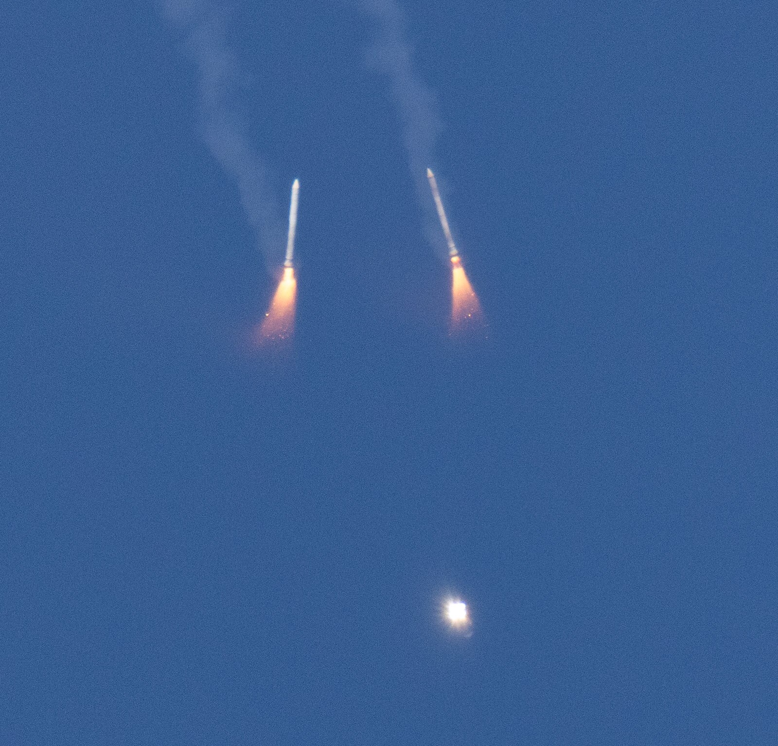 The two rocket boosters seen dropping from the sky. (Photo: Nasa)