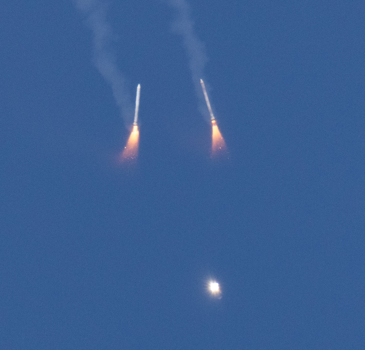 The two rocket boosters seen dropping from the sky. (Photo: Nasa)