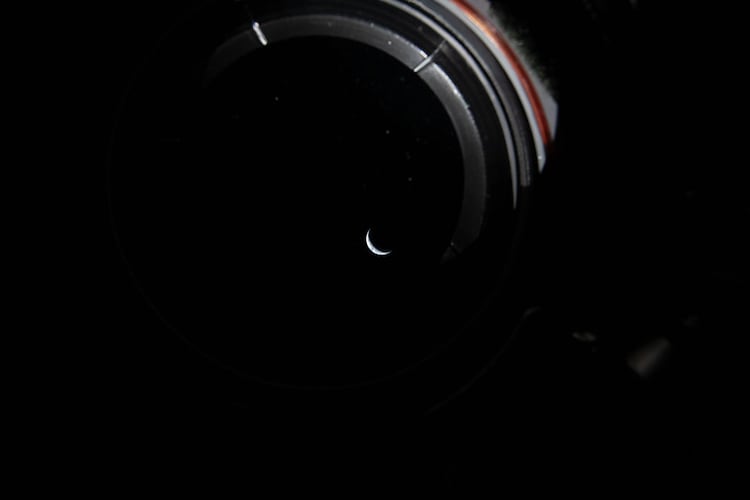 Earth is seen as a cresecent in space from aboard the Orion. (Photo: Nasa)