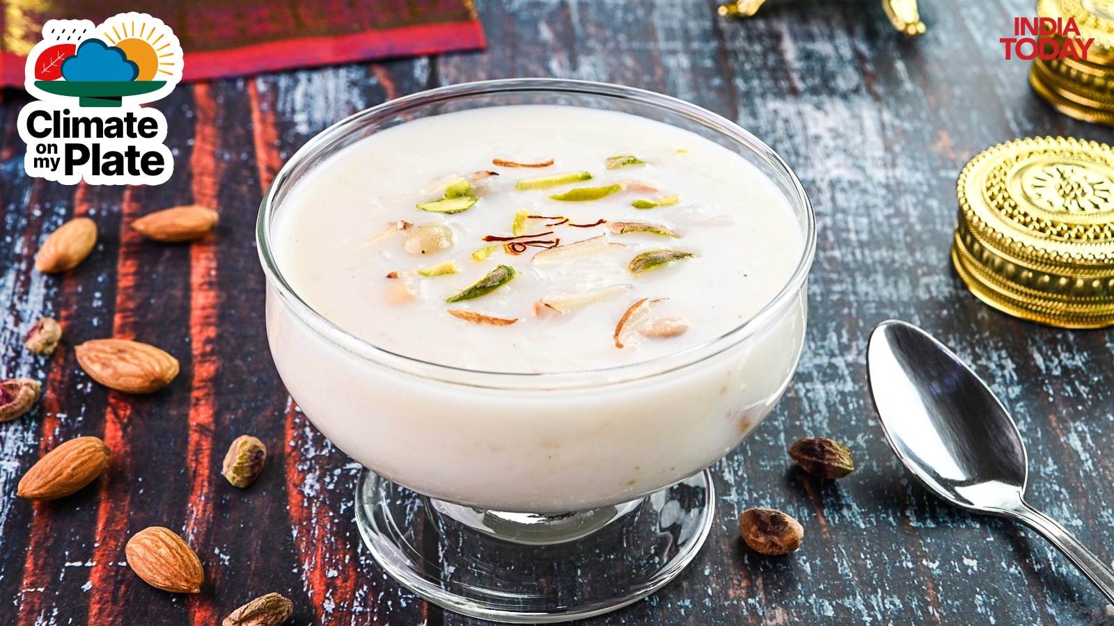 A glass of milk mixed with dry fruits sits on a table. (Photo: Getty)