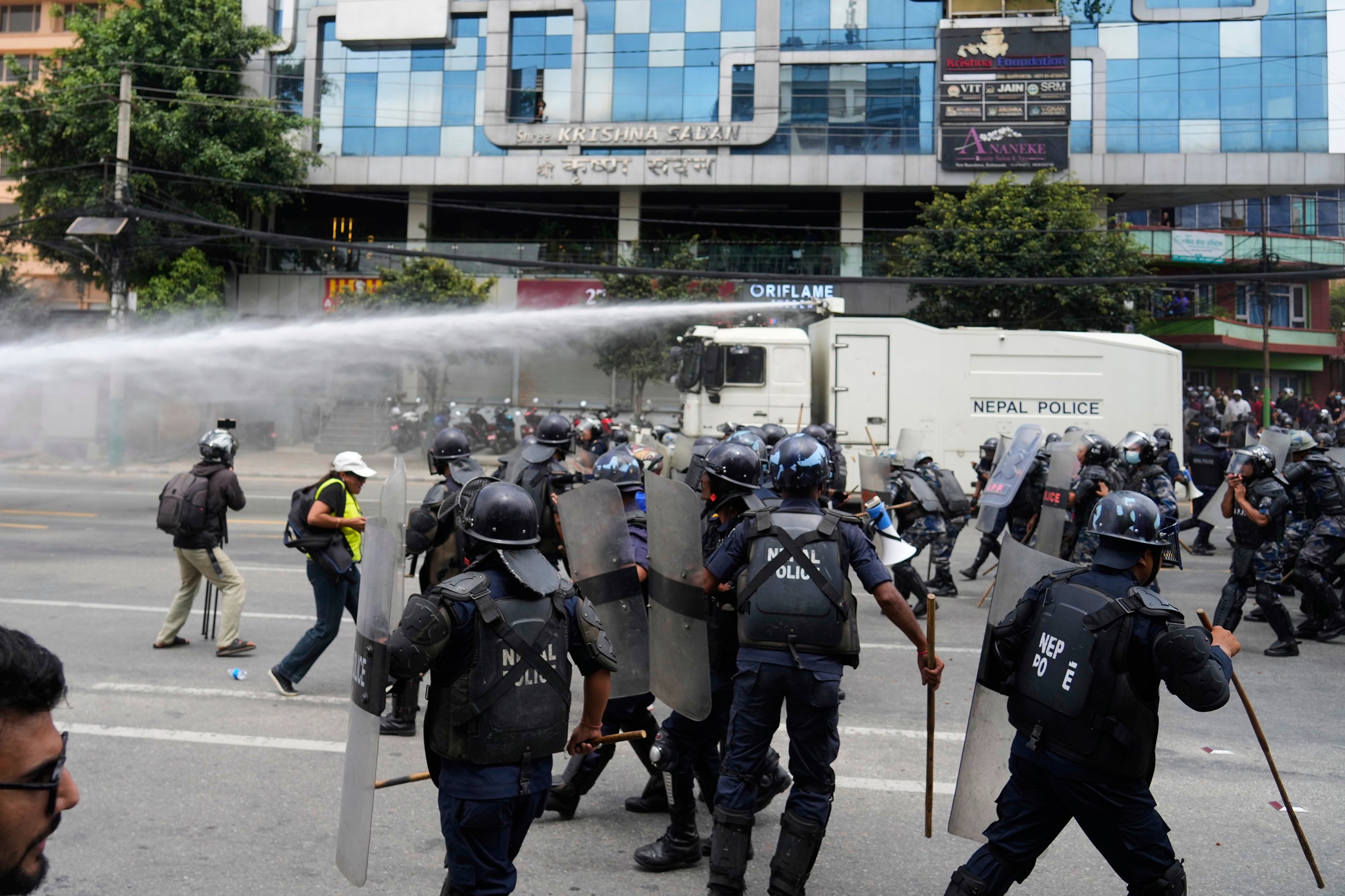 Riot police clash with the protesters outside the Parliament building in Kathmandu, Nepal. (Photo: AP)