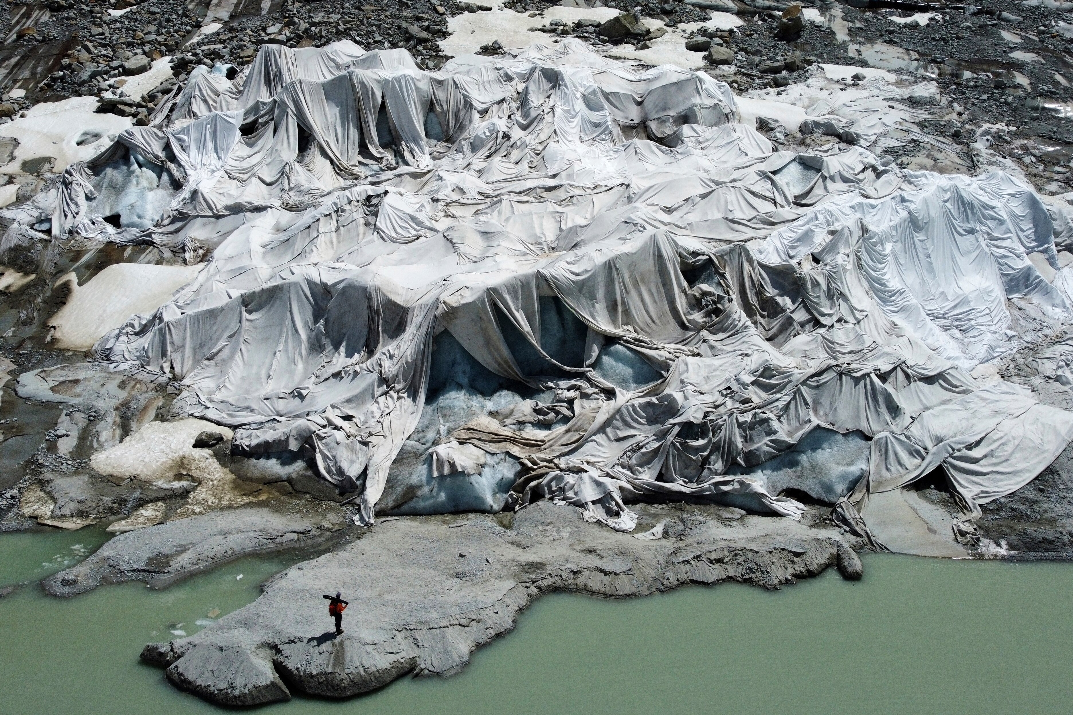 The Rhone Glacier in Switzerland is covered by sheets as GLAMOS monitors it. (Photo: AFP)