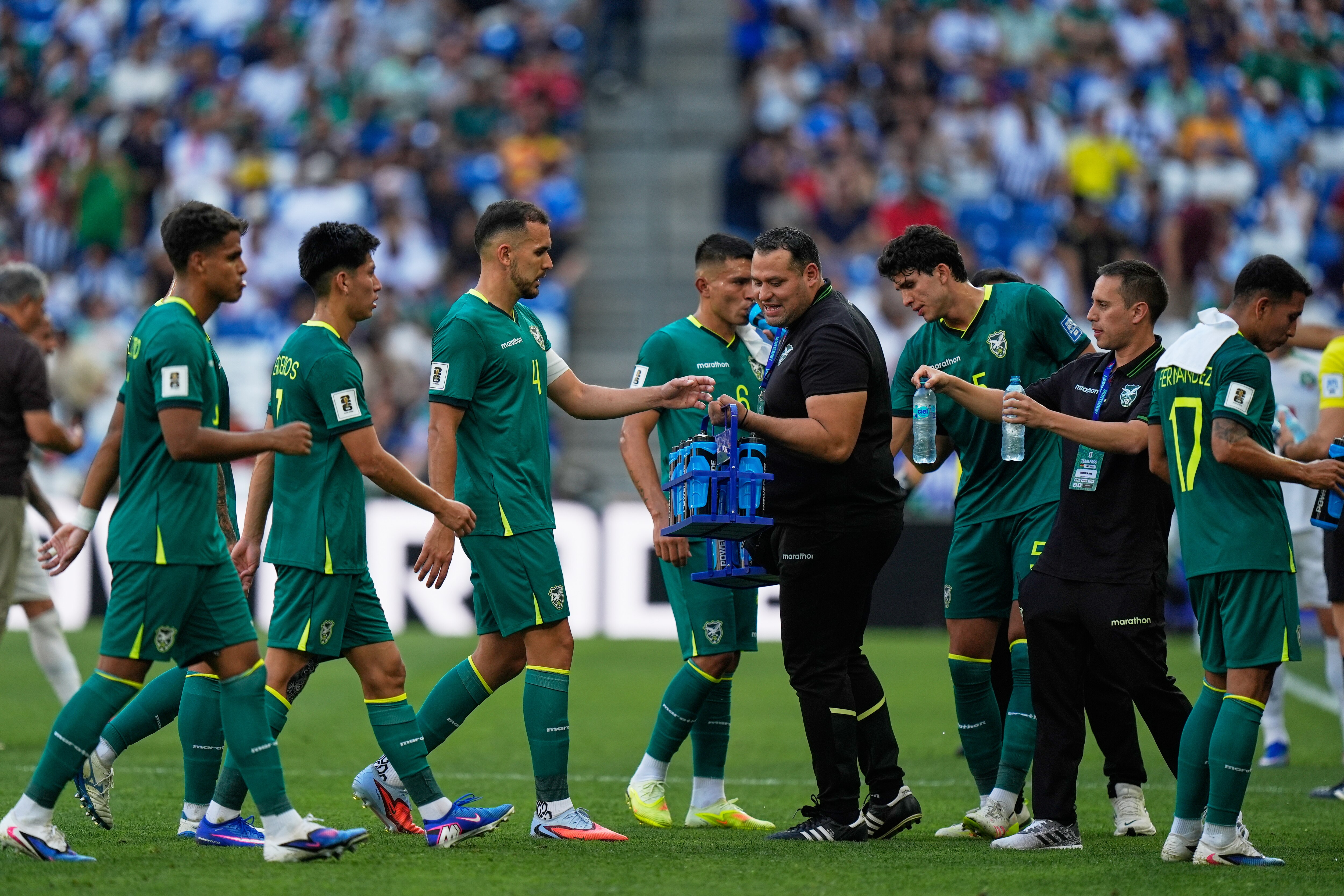 Bolivia's players take a hydration break during a World Cup playoff. (Photo: AP)