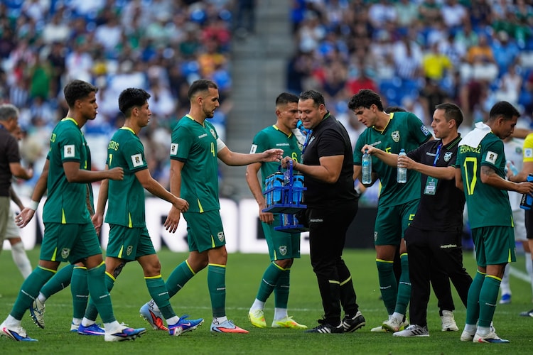 Bolivia's players take a hydration break during a World Cup playoff. (Photo: AP)