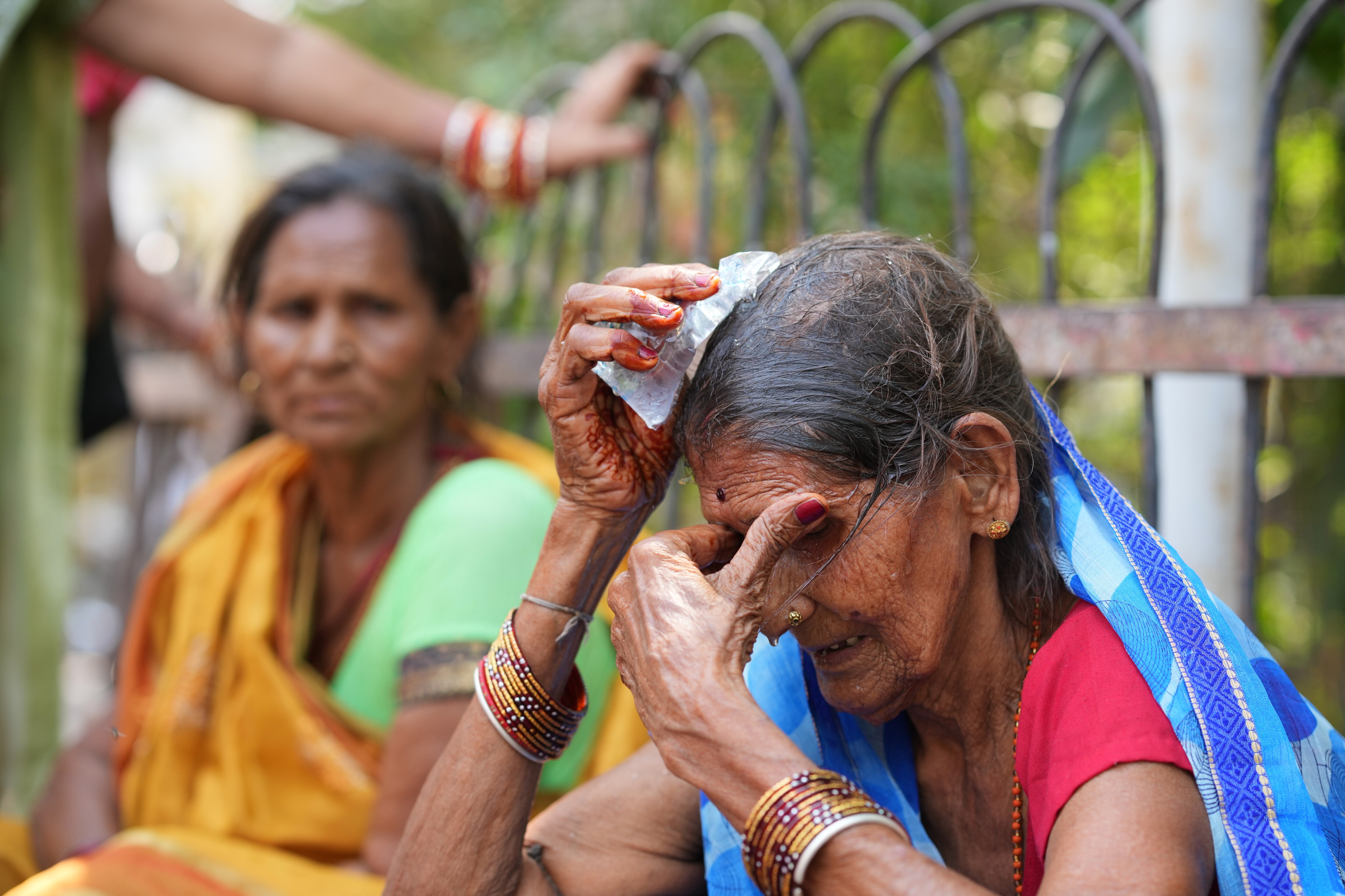 A woman cools herself off with an ice pack on a hot day in Banda, UP. (Photo: AP)