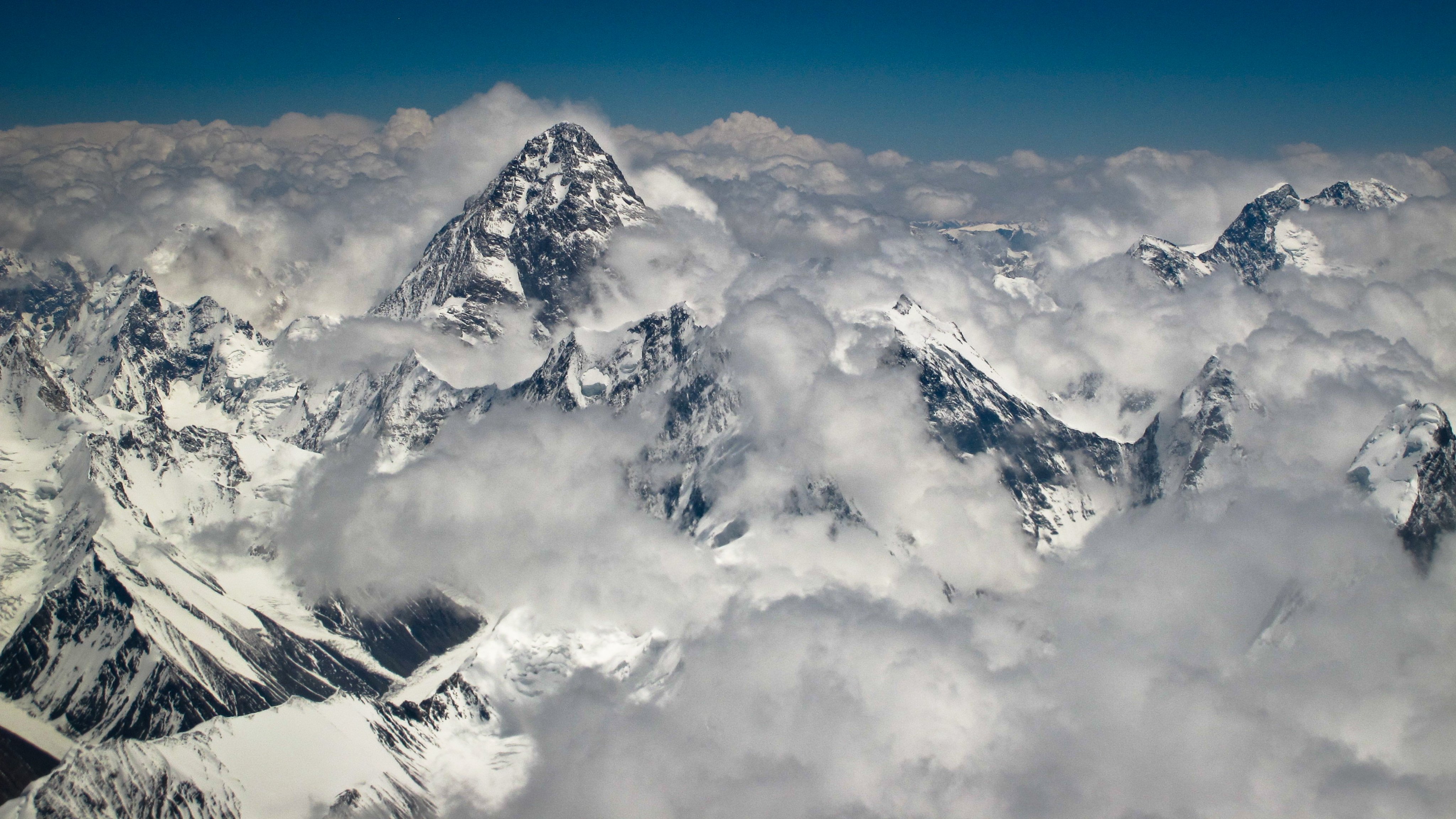 An aerial image of Mount K2 shrouded by clouds and snow. (Photo: X)