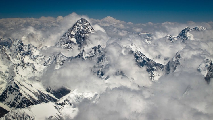 An aerial image of Mount K2 shrouded by clouds and snow. (Photo: X)