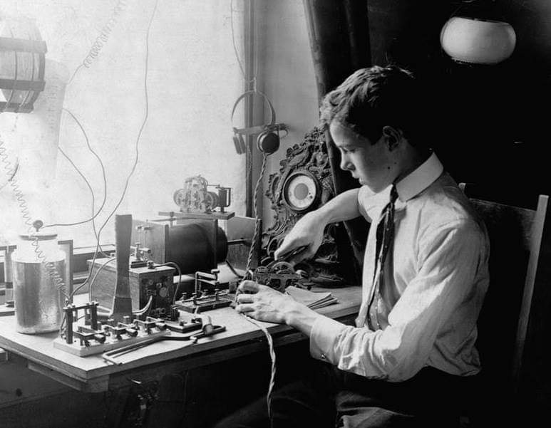 A young boy uses a building a morse code machine in 1905. (Photo: X/@2Communications)