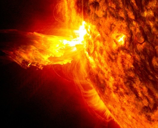 An image shows the bright light of a solar flare on the left side of the Sun. (Photo: Nasa)