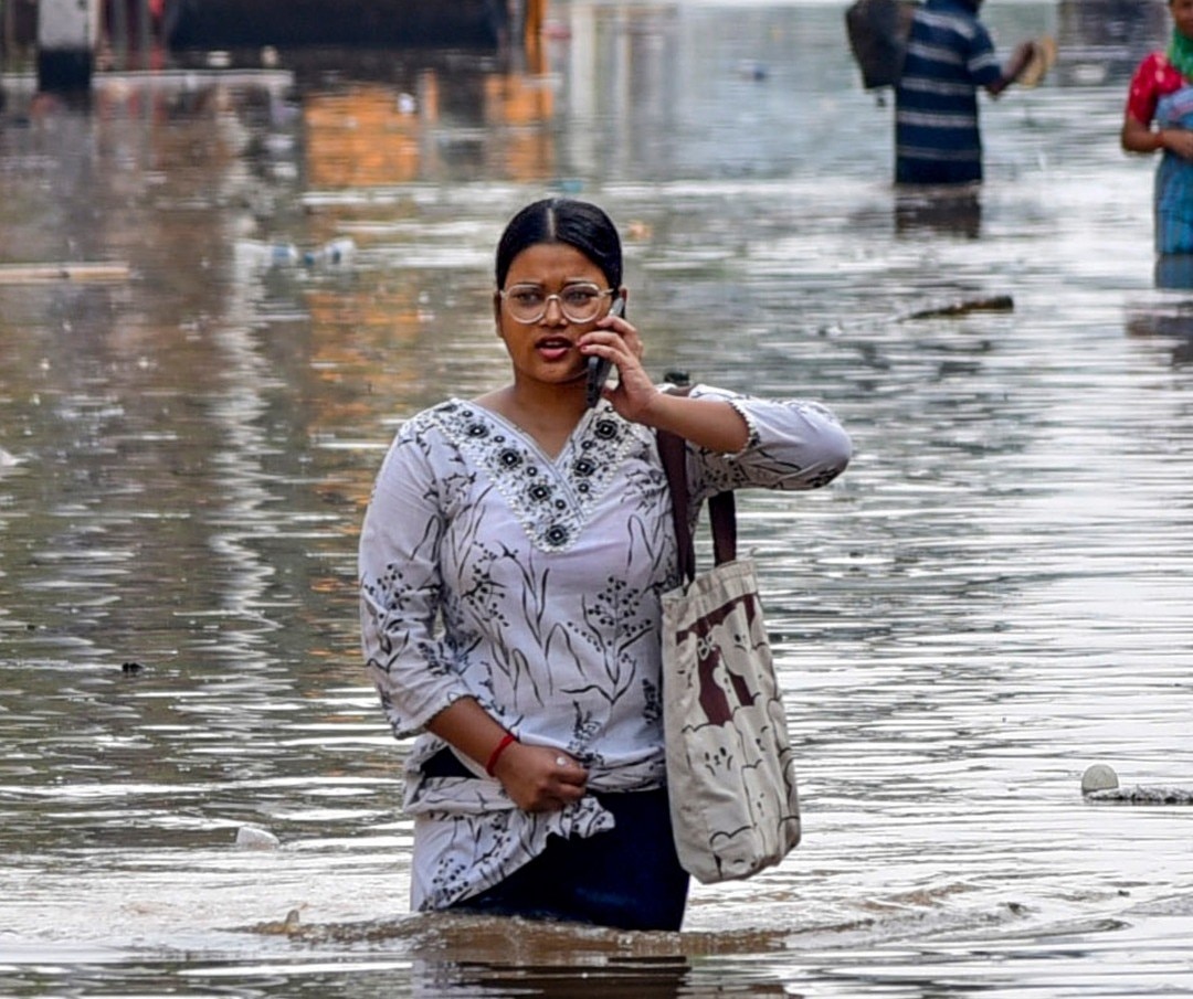 A woman wades through a water-logged street in Guwahati, Assam. (Photo: ITG)