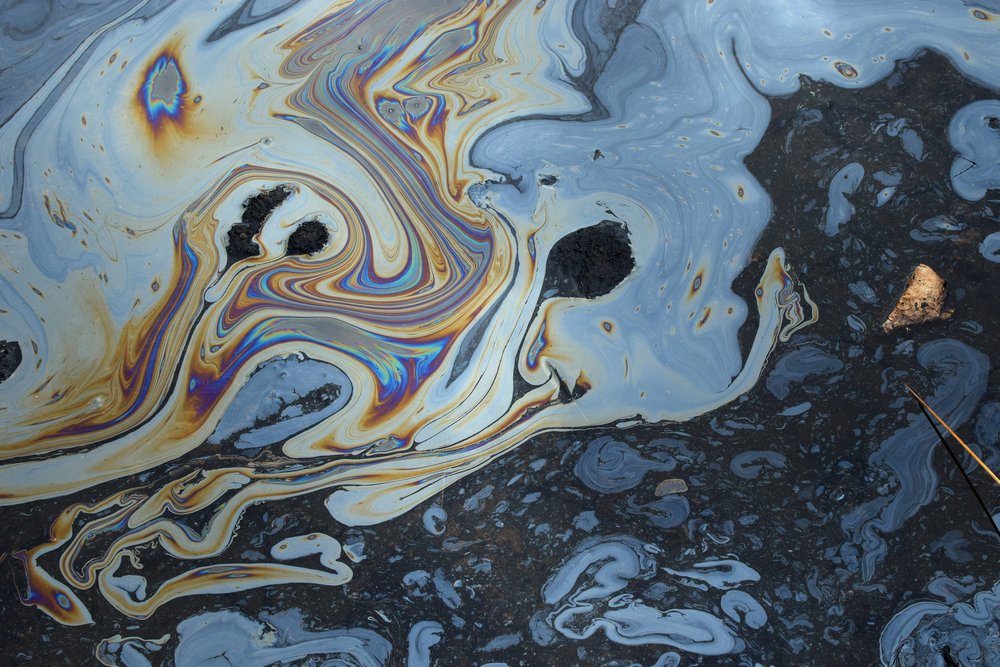A photo showing a layer of oil on top of water surface after an oil spill. (Photo: X/@GovAcctProj)