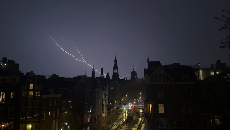 A view of the Amsterdam cityscape as lightining strikes. (Photo: X)