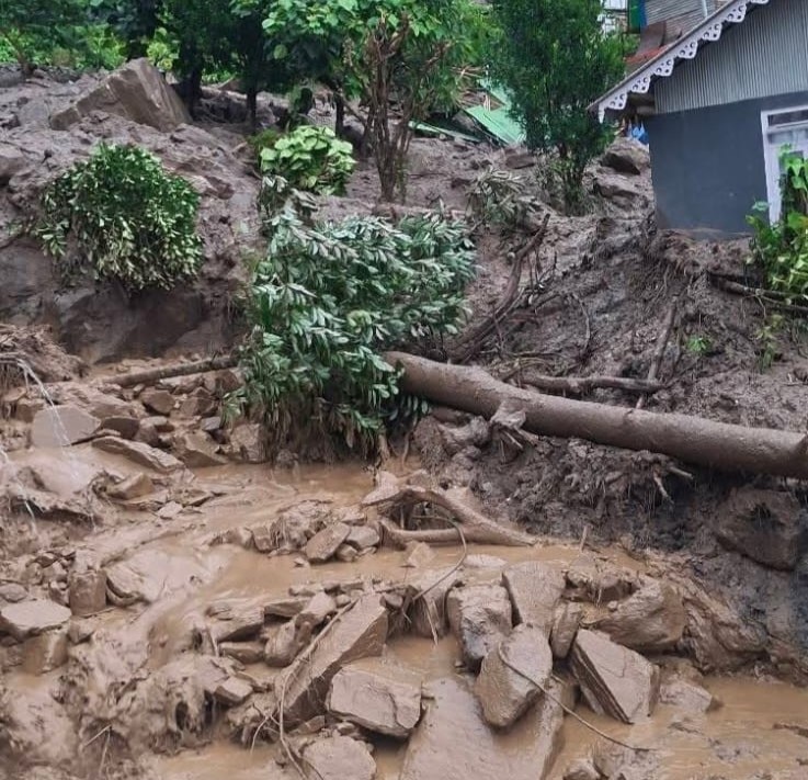 Debris and mud is seen near a house in Rimbi after the massive landslide. (Photo: ANI)