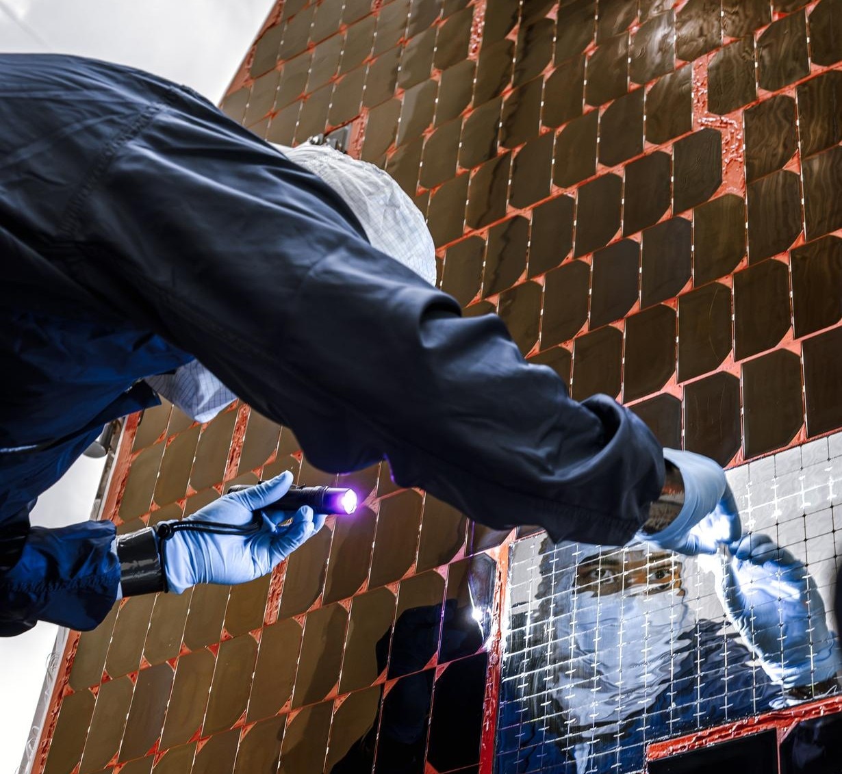 A Nasa technician examines the Nancy Grace Roman solar panels. (Photo: Nasa)
