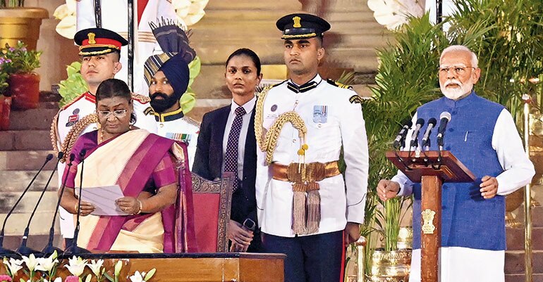 AYE CAPTAIN: PM Modi being sworn in by President Droupadi Murmu, Jun. 9. (Photo: Hindustan Times)