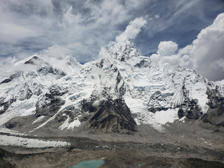 Snow-capped peaks in the Himalayas under a cloudy sky. (Photo: Pexels)